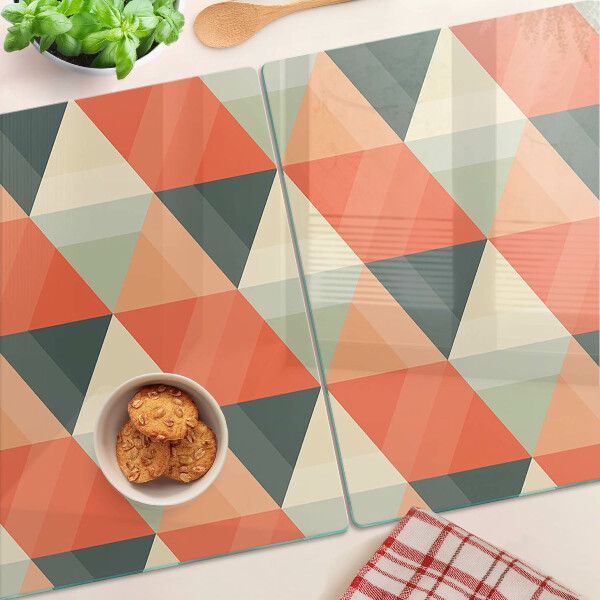 Tagliere in vetro temperato con motivo a triangoli nei toni dell'arancione