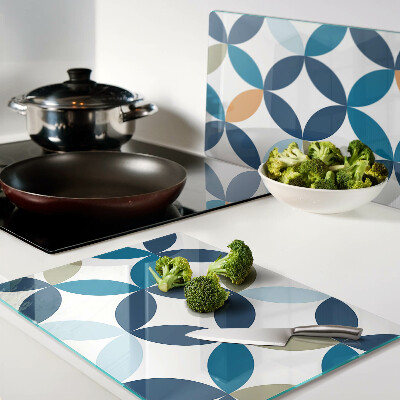 Tagliere in vetro con motivo di foglie geometriche in vari colori