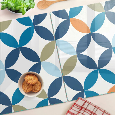 Tagliere in vetro con motivo di foglie geometriche in vari colori