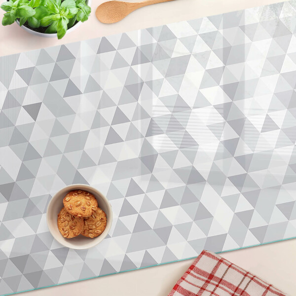 Tagliere in vetro temperato con motivo a triangoli nei toni del grigio