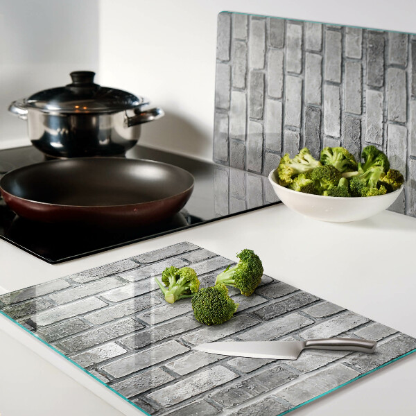 Tagliere in vetro temperato con motivo a muro di mattoni nei toni del grigio