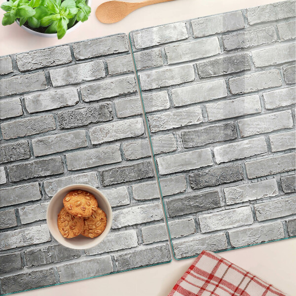 Tagliere in vetro temperato con motivo a muro di mattoni nei toni del grigio