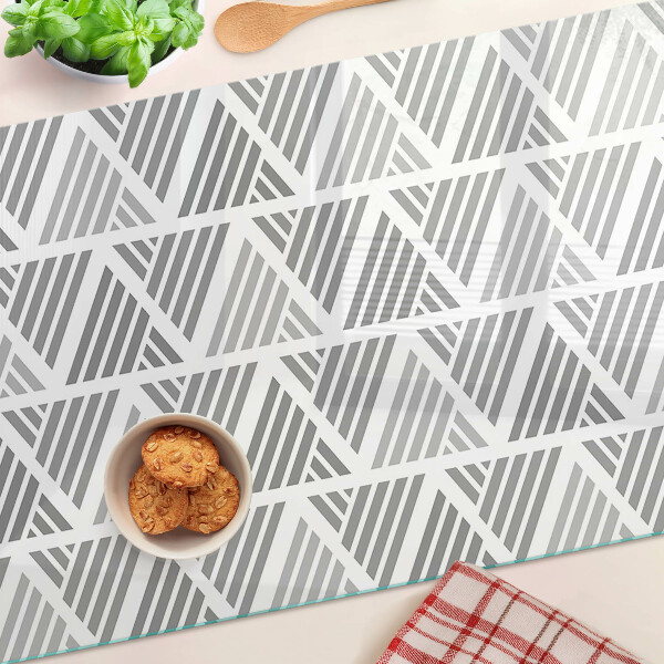 Tagliere in vetro temperato con motivi geometrici nei toni del grigio