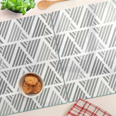 Tagliere in vetro temperato con motivi geometrici nei toni del grigio
