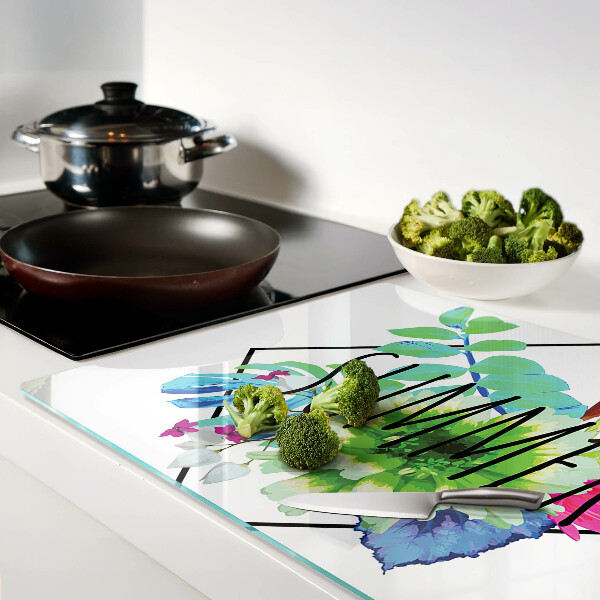 Tagliere in vetro con motivo di fiori estivi e la scritta 