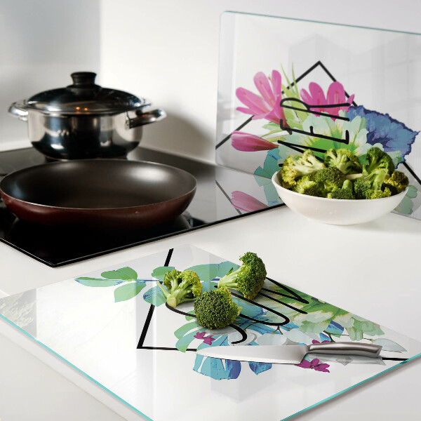 Tagliere in vetro con motivo di fiori estivi e la scritta 