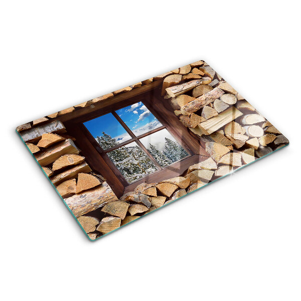Tagliere in vetro temperato con stampa raffigurante un paesaggio invernale visto attraverso una finestra