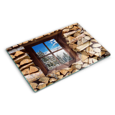 Tagliere in vetro temperato con stampa raffigurante un paesaggio invernale visto attraverso una finestra