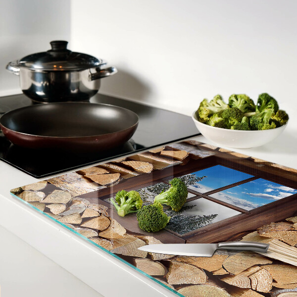 Tagliere in vetro temperato con stampa raffigurante un paesaggio invernale visto attraverso una finestra