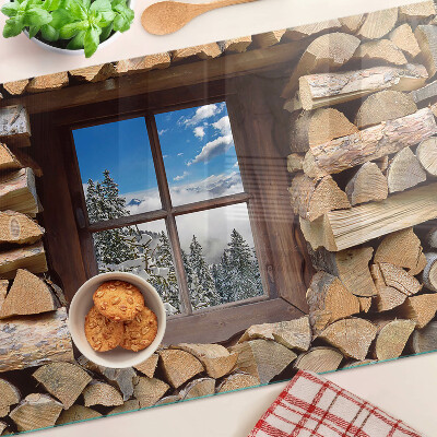 Tagliere in vetro temperato con stampa raffigurante un paesaggio invernale visto attraverso una finestra