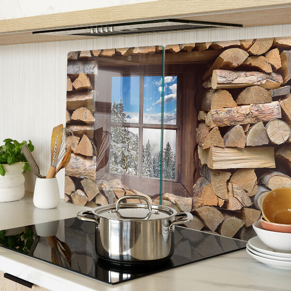 Tagliere in vetro temperato con stampa raffigurante un paesaggio invernale visto attraverso una finestra