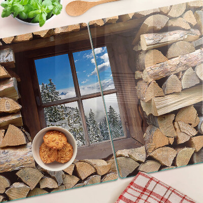 Tagliere in vetro temperato con stampa raffigurante un paesaggio invernale visto attraverso una finestra