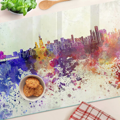 Tagliere in vetro con stampa del panorama della città in macchie colorate