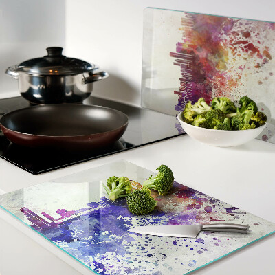 Tagliere in vetro con stampa del panorama della città in macchie colorate