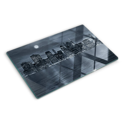 Tagliere in vetro con stampa del panorama della città riflesso a notte