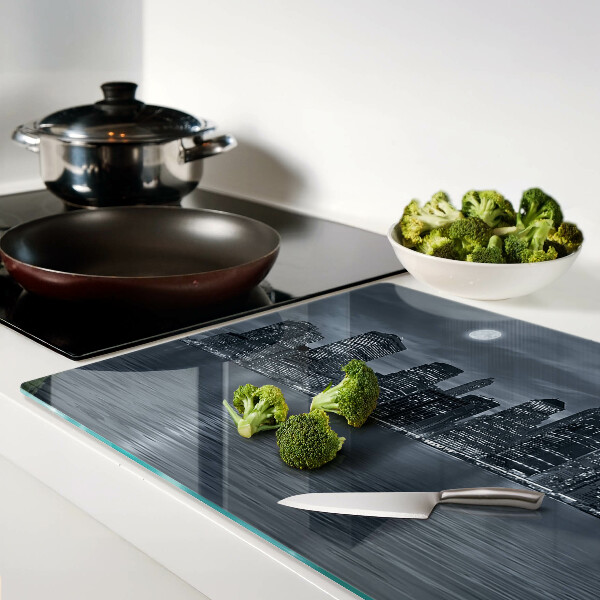 Tagliere in vetro con stampa del panorama della città riflesso a notte