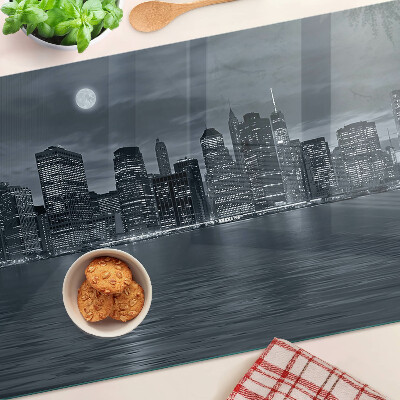 Tagliere in vetro con stampa del panorama della città riflesso a notte