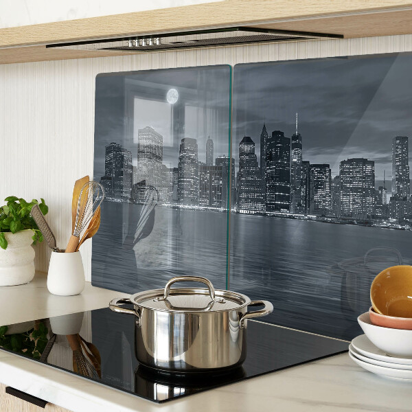 Tagliere in vetro con stampa del panorama della città riflesso a notte