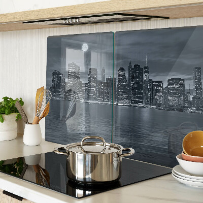 Tagliere in vetro con stampa del panorama della città riflesso a notte