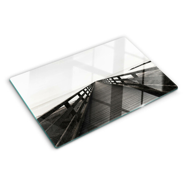 Tagliere in vetro temperato con stampa raffigurante un pontile di legno sull'acqua
