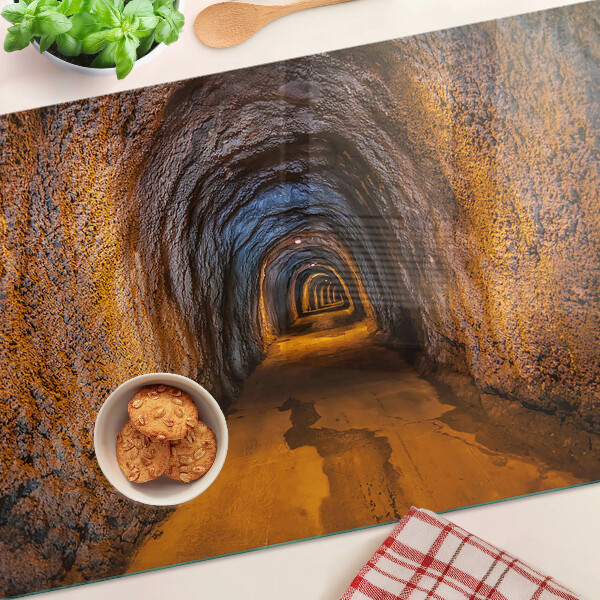 Tagliere in vetro temperato con stampa di un tunnel in una grotta e illuminazione