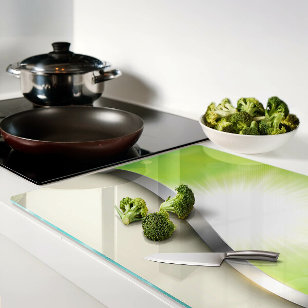 Tagliere in vetro temperato con motivo bokeh verde con raggi di luce