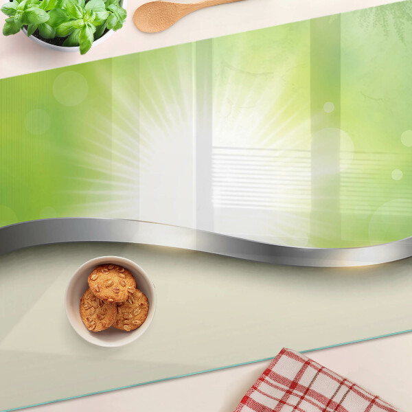 Tagliere in vetro temperato con motivo bokeh verde con raggi di luce