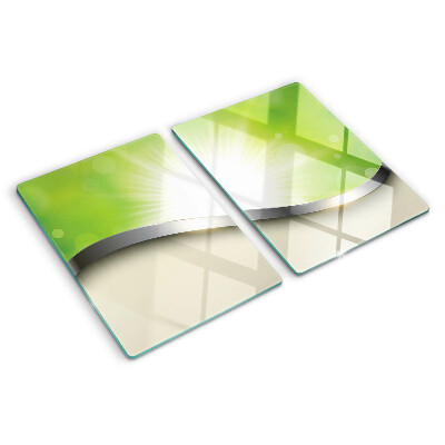 Tagliere in vetro temperato con motivo bokeh verde con raggi di luce