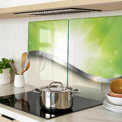 Tagliere in vetro temperato con motivo bokeh verde con raggi di luce