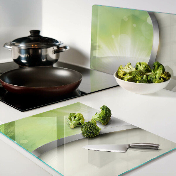 Tagliere in vetro temperato con motivo bokeh verde con raggi di luce