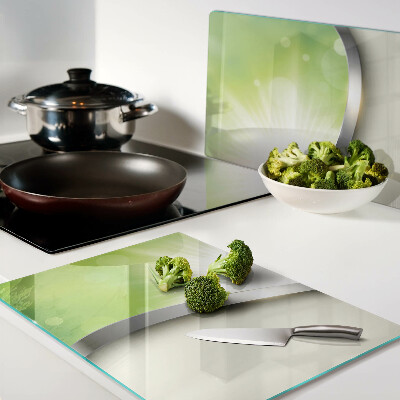Tagliere in vetro temperato con motivo bokeh verde con raggi di luce
