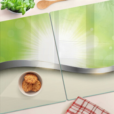 Tagliere in vetro temperato con motivo bokeh verde con raggi di luce