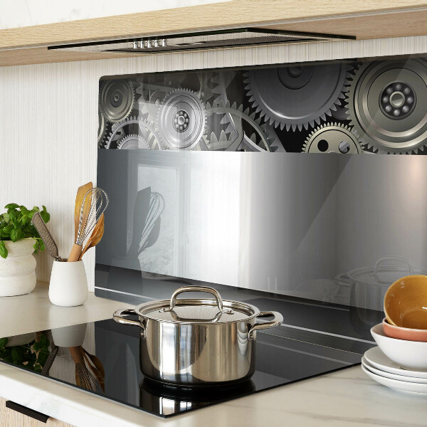 Tagliere in vetro con motivo di ingranaggi meccanici e superfici metalliche