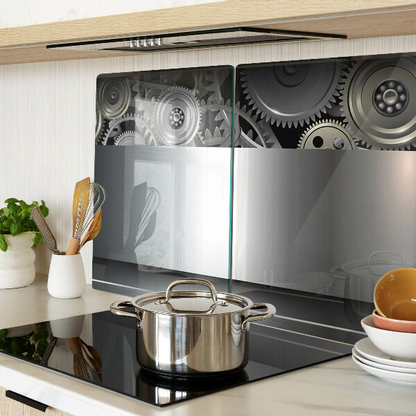 Tagliere in vetro con motivo di ingranaggi meccanici e superfici metalliche