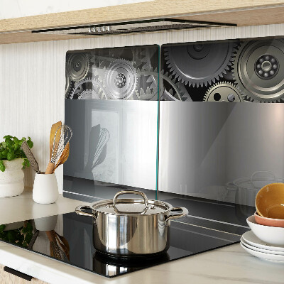 Tagliere in vetro con motivo di ingranaggi meccanici e superfici metalliche