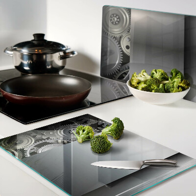 Tagliere in vetro con motivo di ingranaggi meccanici e superfici metalliche