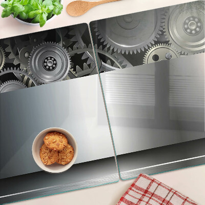 Tagliere in vetro con motivo di ingranaggi meccanici e superfici metalliche