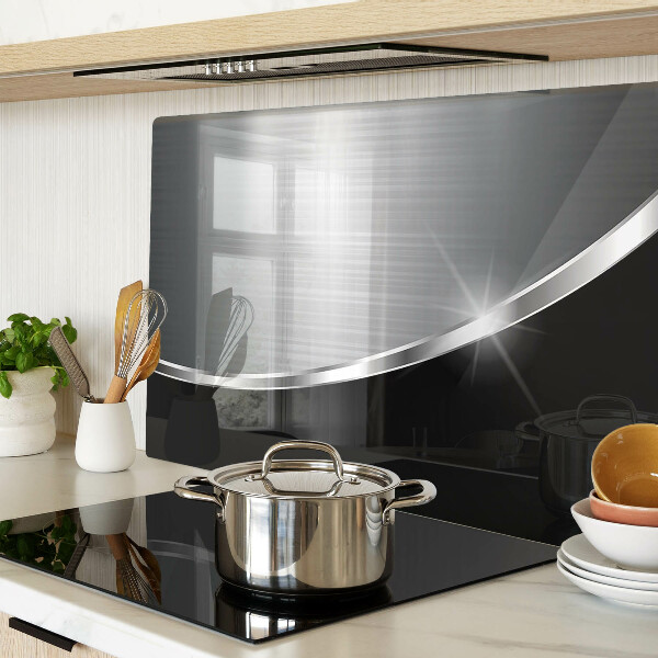 Tagliere in vetro con finitura metallica e riflessi decorativi