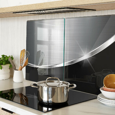 Tagliere in vetro con finitura metallica e riflessi decorativi