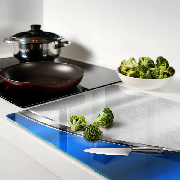 Tagliere in vetro temperato con motivo metallico e accenti blu