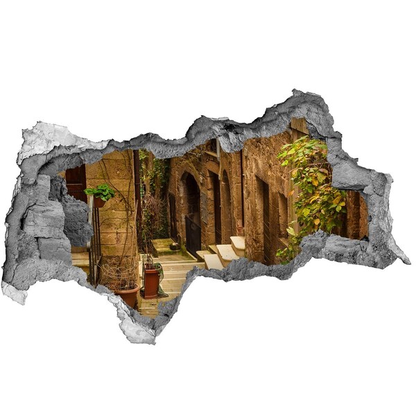 Sticker effetto rottura muro Una strada affascinante in città