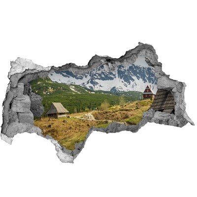 Sticker effetto rottura muro Paesaggio montano con un villaggio