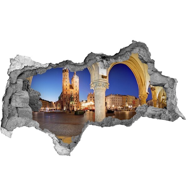 Sticker effetto rottura muro La piazza del mercato principale di Cracovia di notte