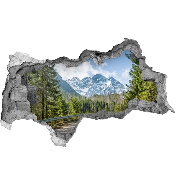 Sticker effetto rottura muro Paesaggio montano dietro il buco nel muro