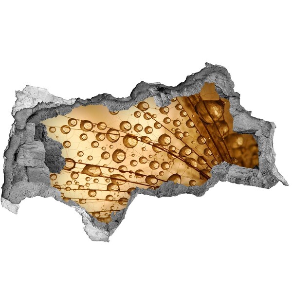 Decorazione da parete buco nel muro Una goccia dorata sullo sfondo di cemento