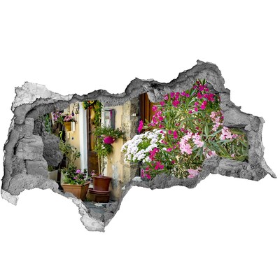 Adesivo con vista dietro il muro Un angolo fiorito in città