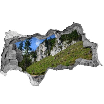 Sticker effetto rottura muro Paesaggio montano visto attraverso un buco nel muro