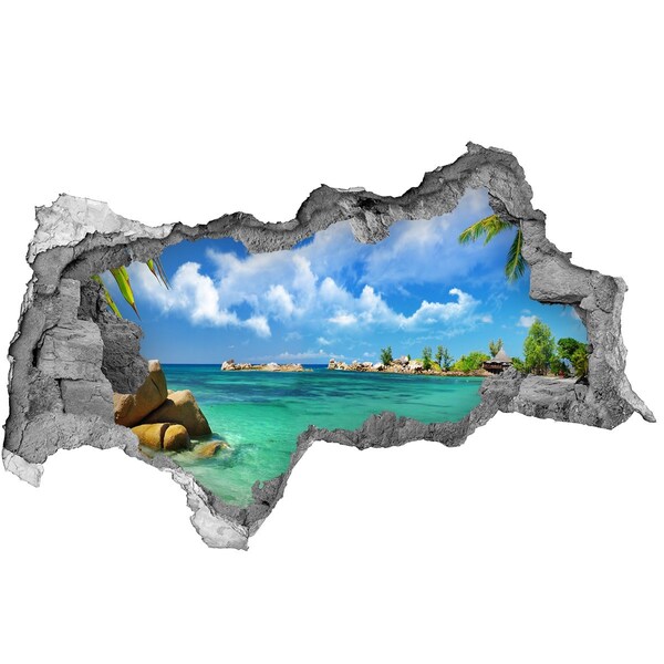 Sticker effetto rottura muro Una spiaggia paradisiaca con acque turchesi