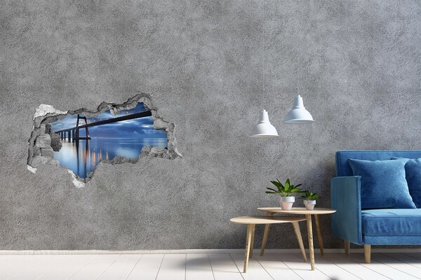 Adesivo con vista dietro il muro Un ponte sull'acqua in una scena notturna