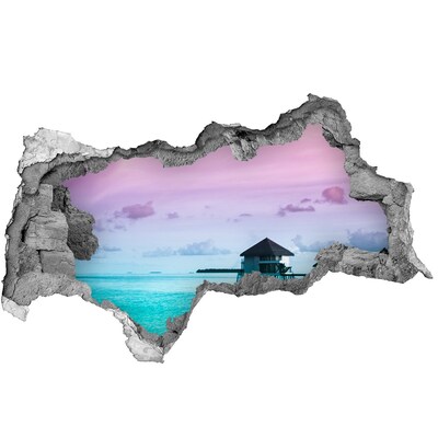 Sticker effetto rottura muro Un'oasi tropicale in riva al mare